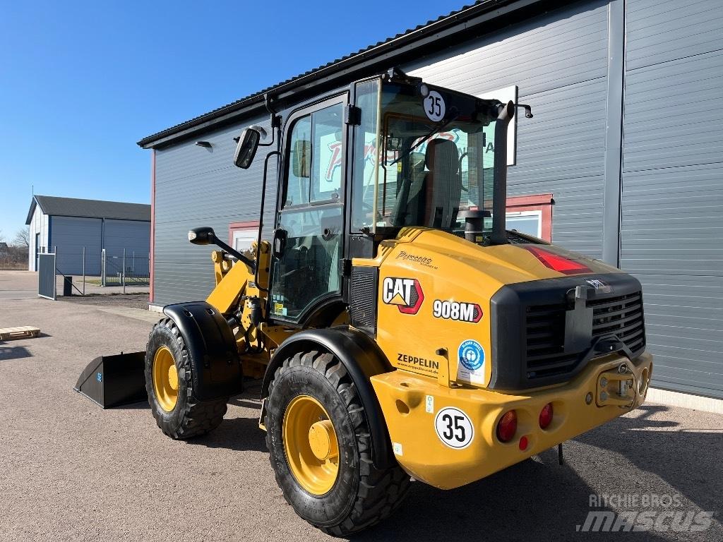 CAT 908M-22 1670Tim Iekrāvēji uz riteņiem