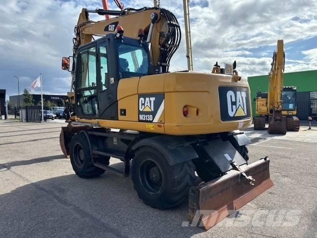CAT M 313 D Ekskavatori uz riteņiem
