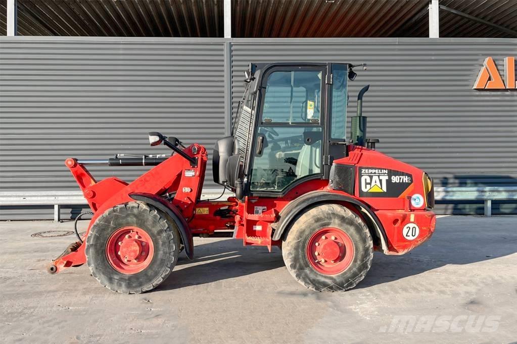 CAT 907H2 Iekrāvēji uz riteņiem