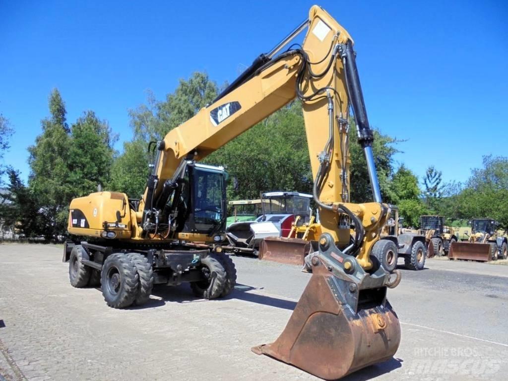 CAT M 322 D Ekskavatori uz riteņiem