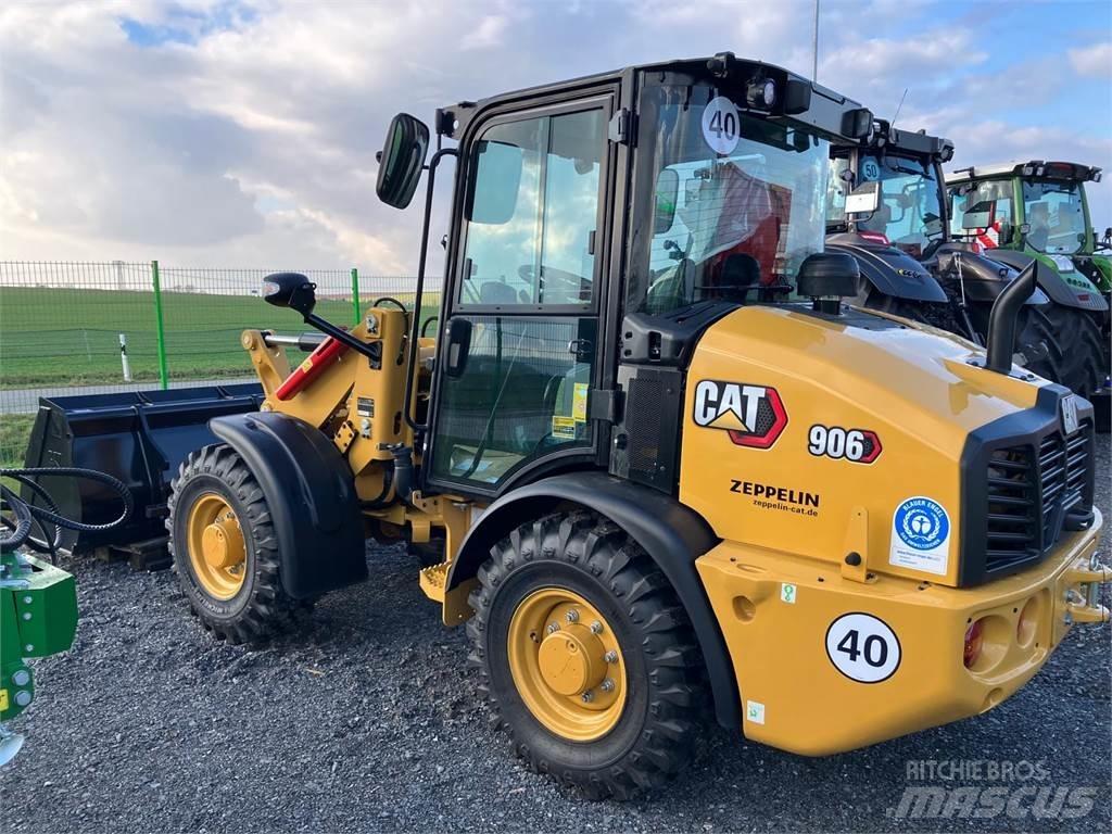 CAT 906 Iekrāvēji uz riteņiem