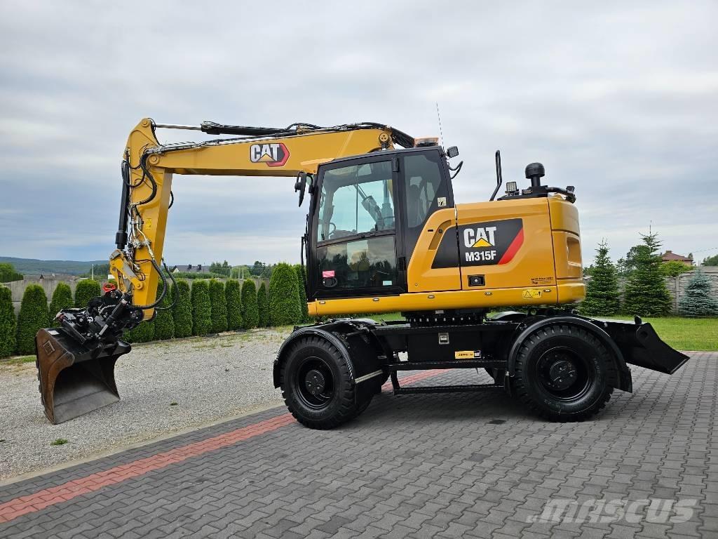 CAT M 315 F Ekskavatori uz riteņiem