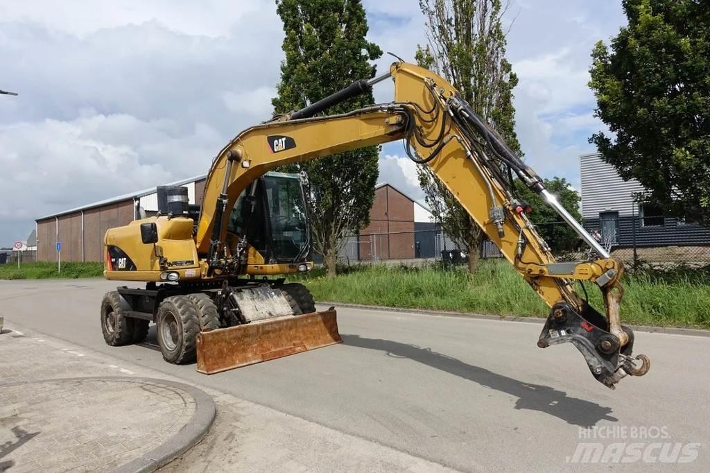 CAT M313 D Ekskavatori uz riteņiem