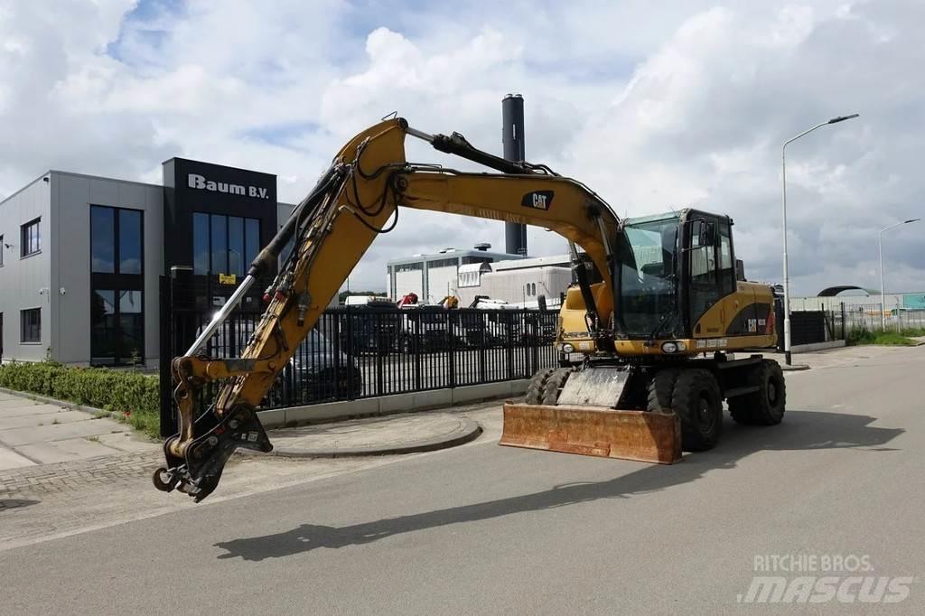CAT M313 D Ekskavatori uz riteņiem