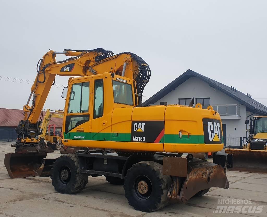 CAT M 316 D Ekskavatori uz riteņiem