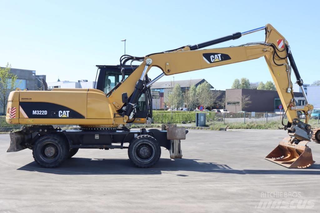 CAT M322D Ekskavatori uz riteņiem