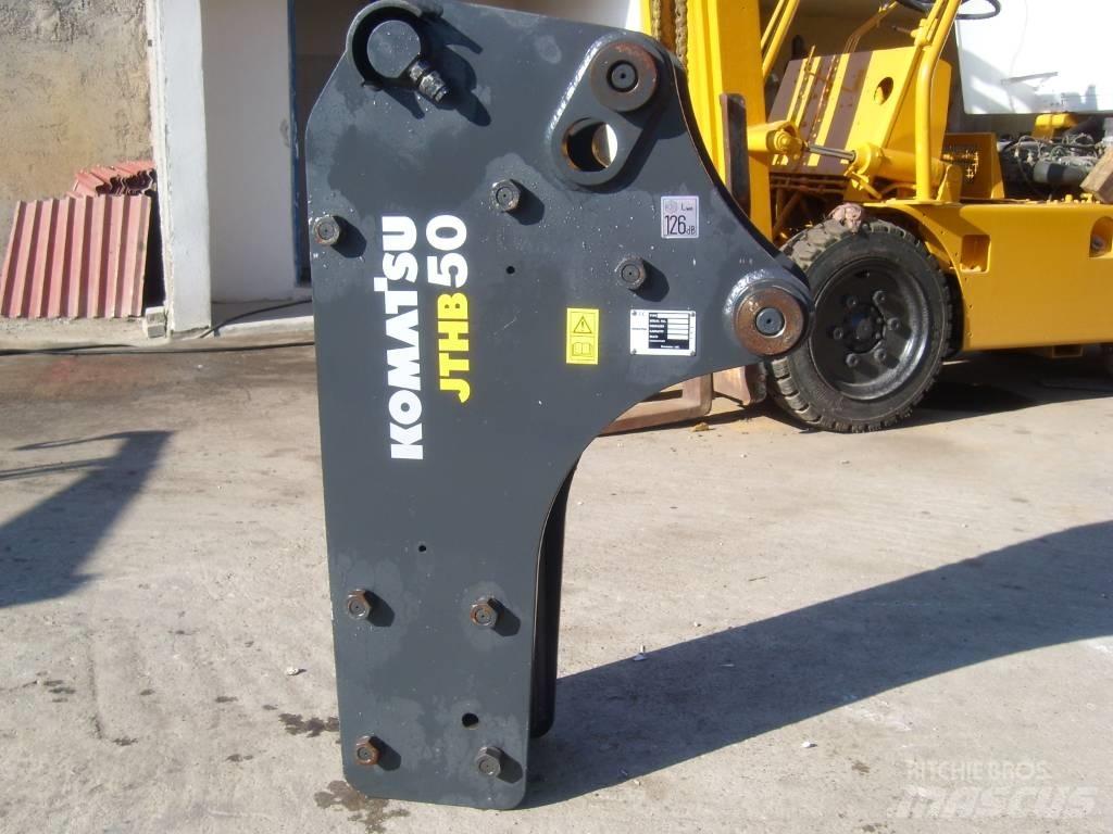 Komatsu 2011 Āmuri/Drupinātāji