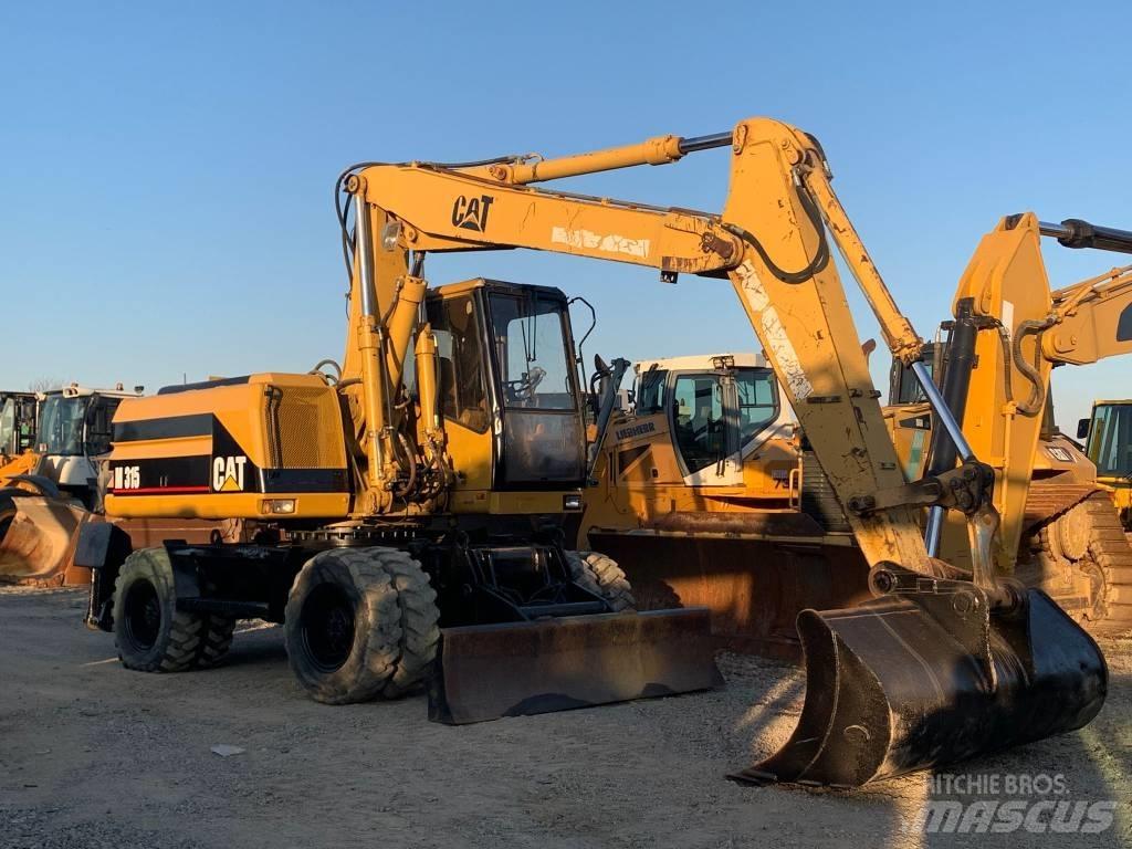 CAT M 315 Ekskavatori uz riteņiem