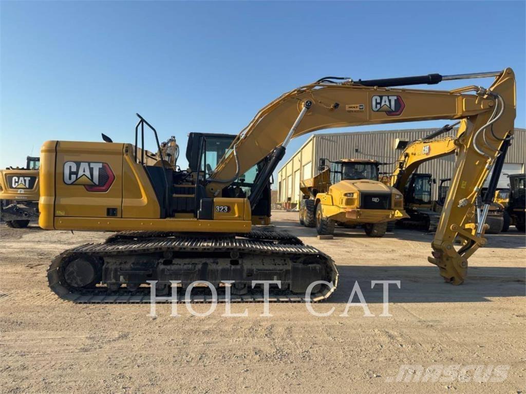 CAT 323 TC Iekrāvēji uz riteņiem