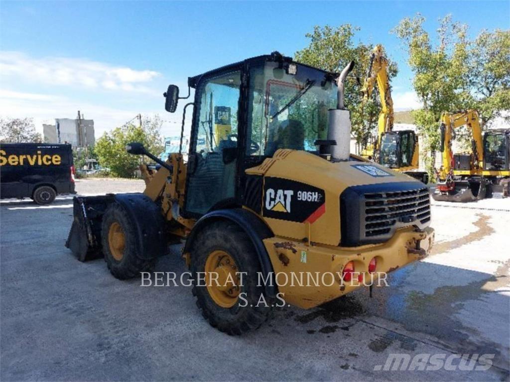 CAT 906H2 Iekrāvēji uz riteņiem