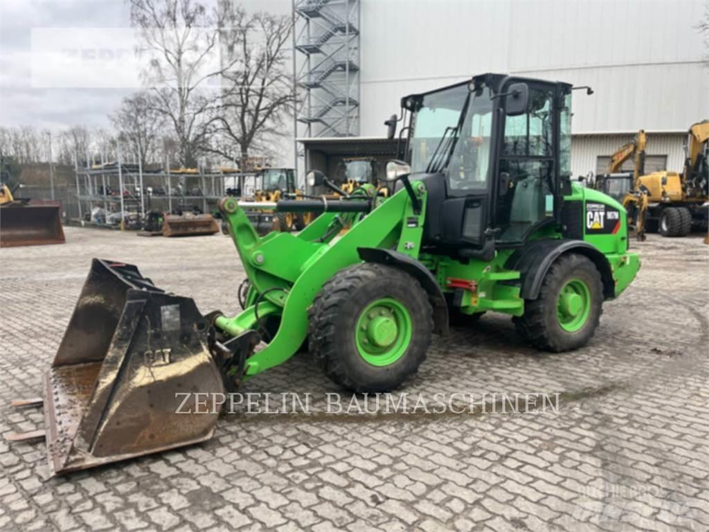 CAT 907M Iekrāvēji uz riteņiem