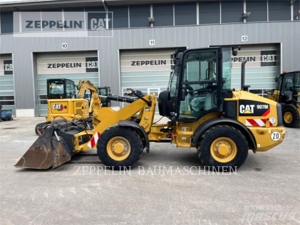 CAT 907M Iekrāvēji uz riteņiem