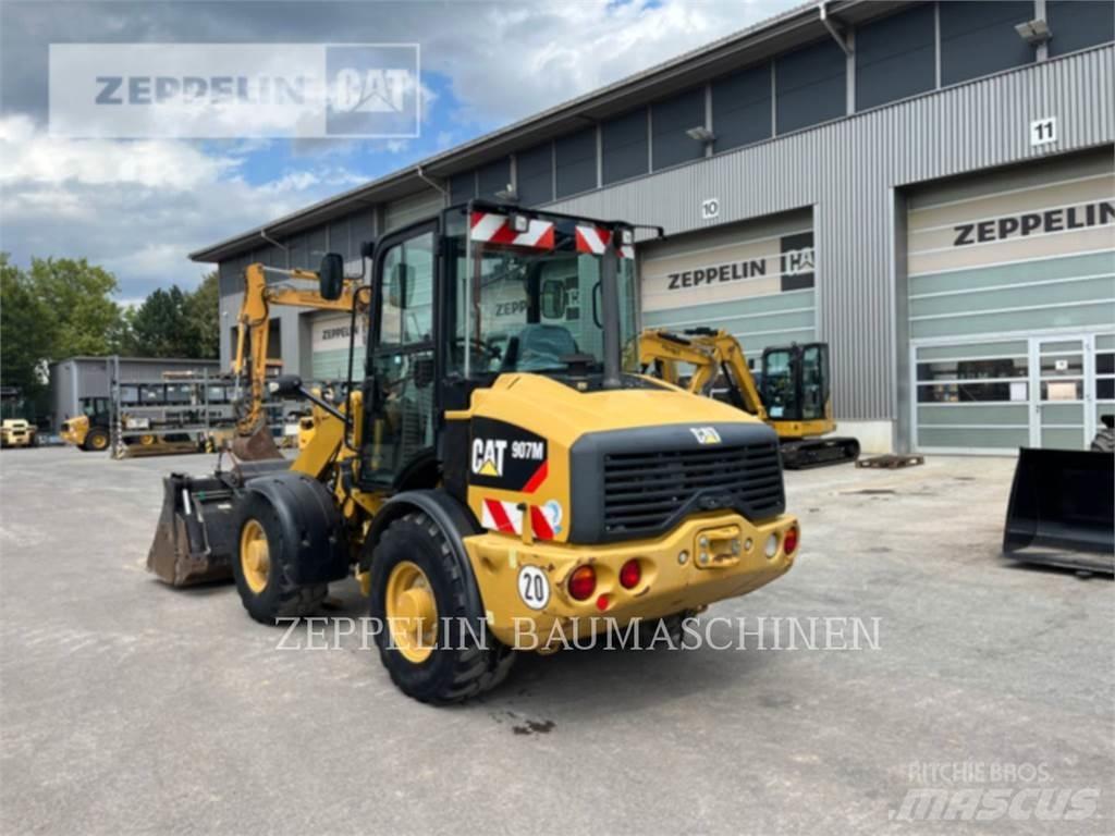 CAT 907M Iekrāvēji uz riteņiem