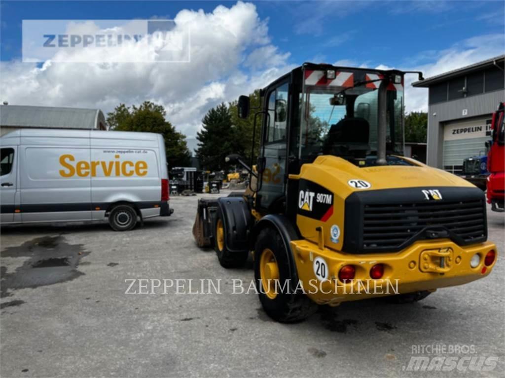 CAT 907M Iekrāvēji uz riteņiem