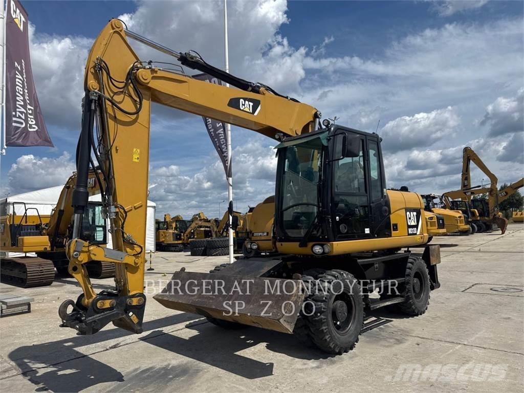 CAT M313D Ekskavatori uz riteņiem