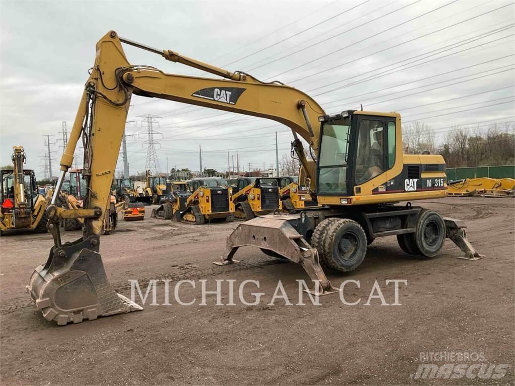 CAT M315 Ekskavatori uz riteņiem