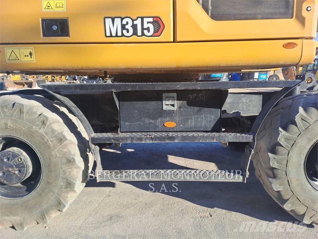 CAT M315 Ekskavatori uz riteņiem