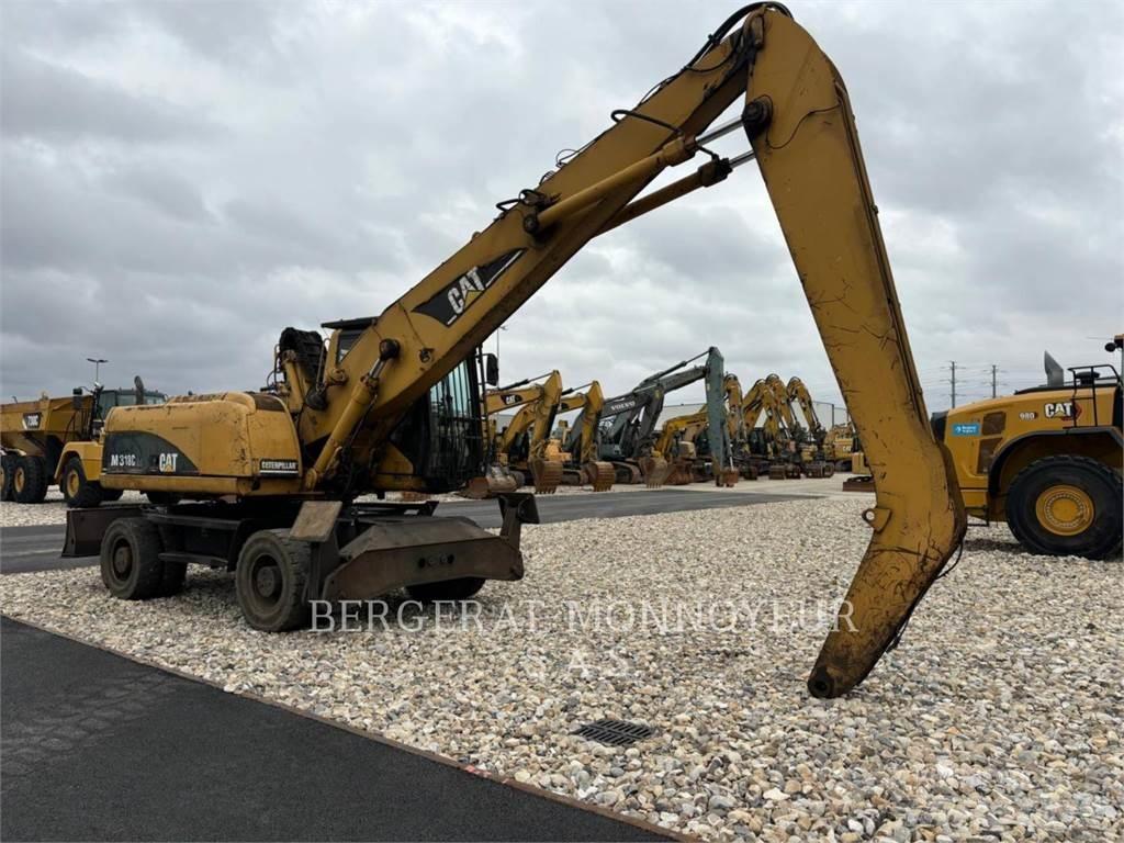 CAT M318C Ekskavatori uz riteņiem