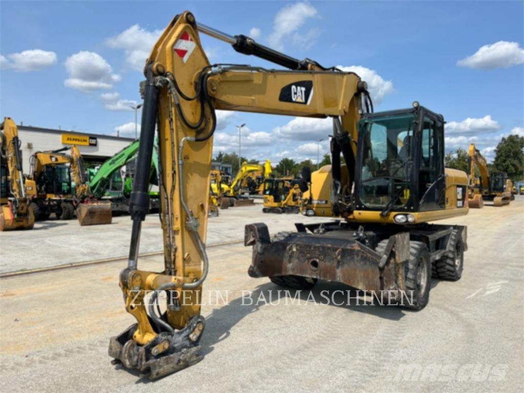 CAT M318D Ekskavatori uz riteņiem