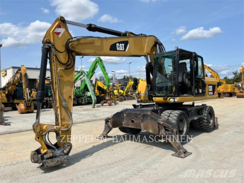CAT M318D Ekskavatori uz riteņiem