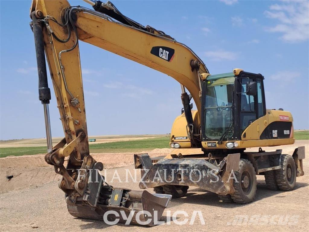 CAT M318D Ekskavatori uz riteņiem