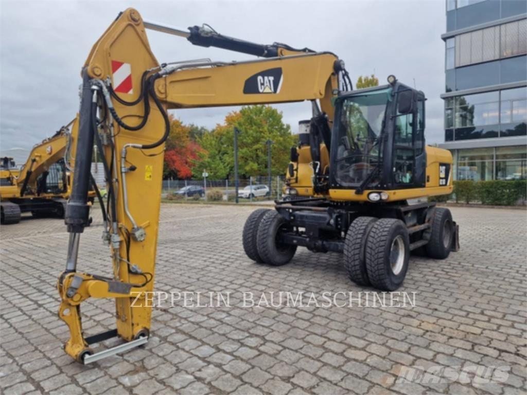 CAT M318D Ekskavatori uz riteņiem