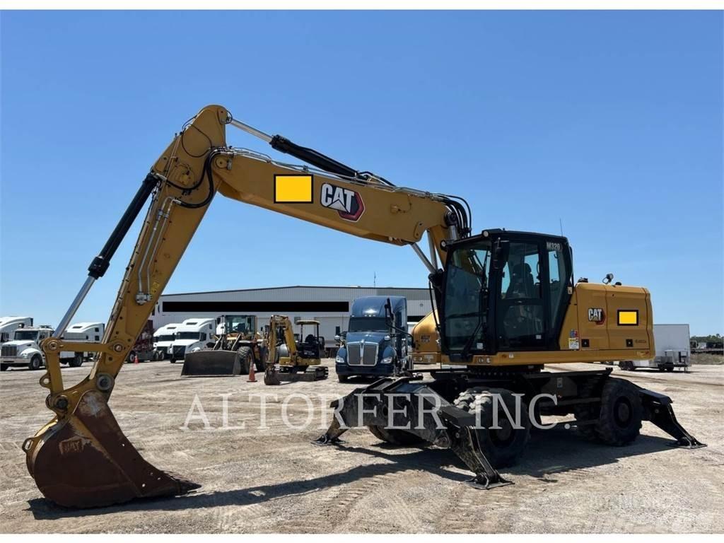 CAT M320 Ekskavatori uz riteņiem