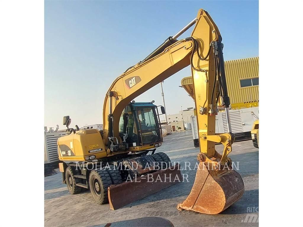 CAT M320D2 Ekskavatori uz riteņiem