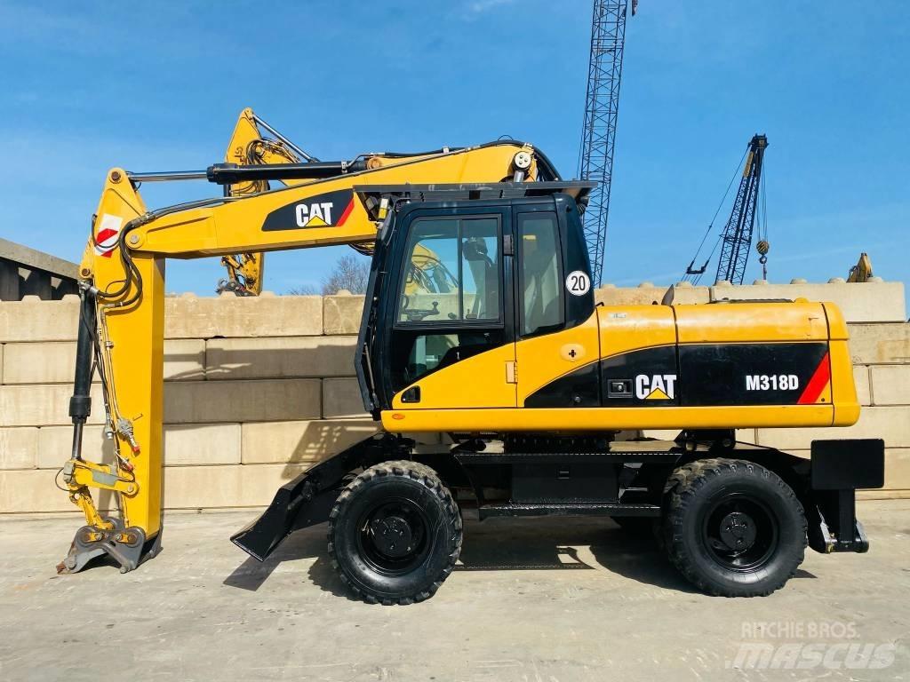 CAT M 318 D Ekskavatori uz riteņiem