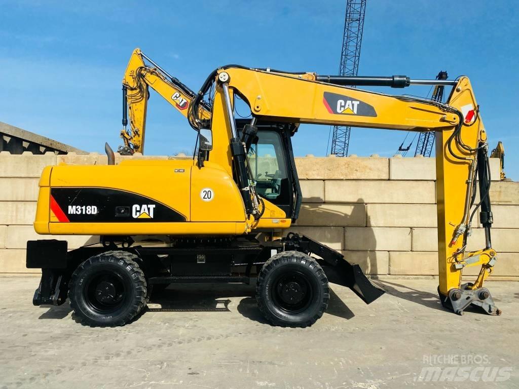 CAT M 318 D Ekskavatori uz riteņiem