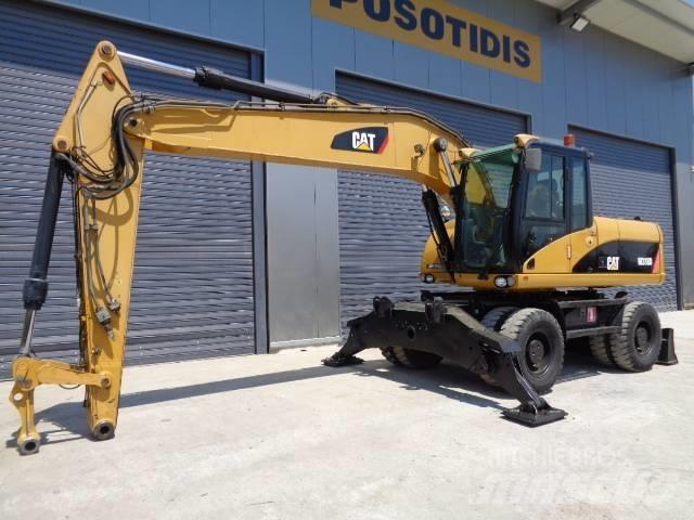 CAT M 318 D Ekskavatori uz riteņiem