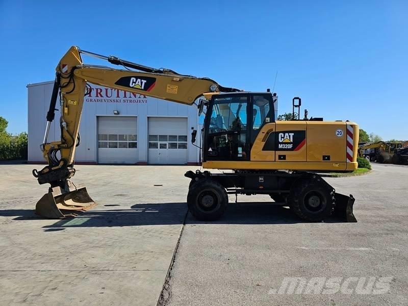 CAT M 320F Ekskavatori uz riteņiem