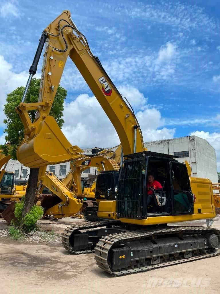 CAT 323 Vidēja lieluma ekskavatori 7 t - 12 t