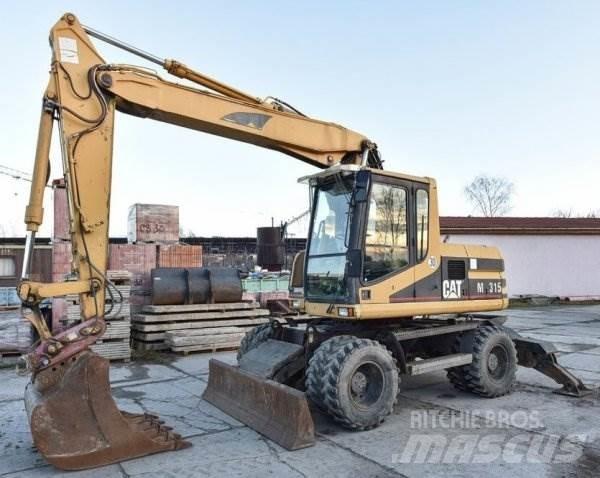 CAT M 315 Ekskavatori uz riteņiem