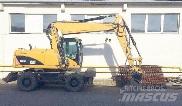 CAT M 315 D Ekskavatori uz riteņiem
