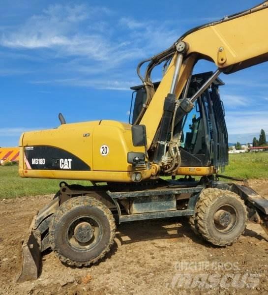 CAT M318 D Ekskavatori uz riteņiem