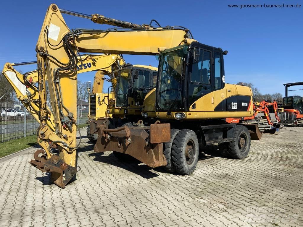 CAT M 315 D Ekskavatori uz riteņiem