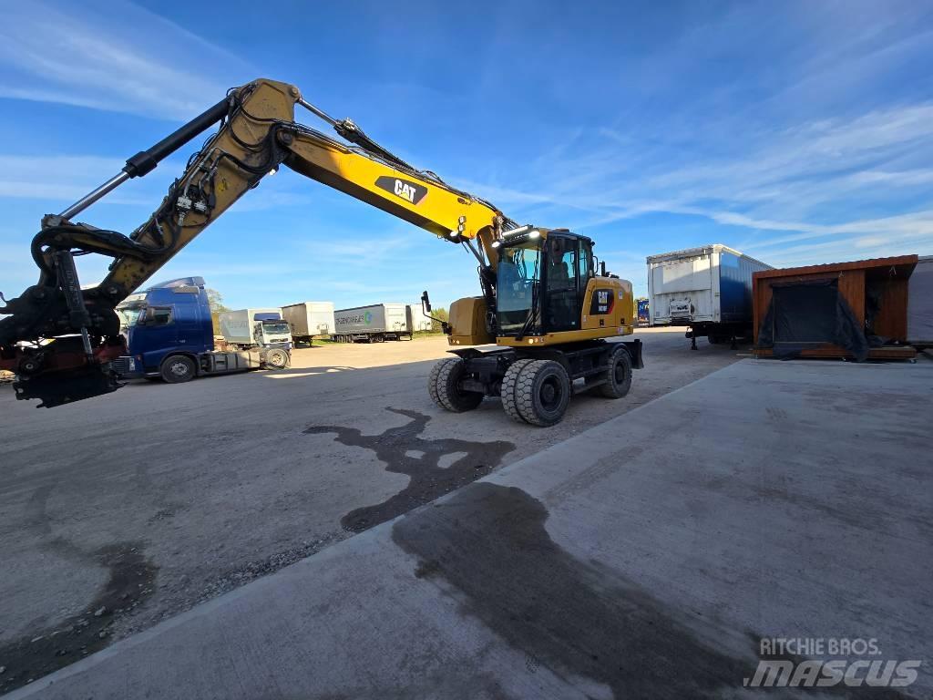 CAT 318 Ekskavatori uz riteņiem