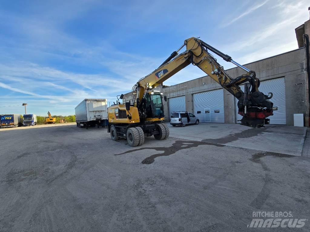 CAT 318 Ekskavatori uz riteņiem