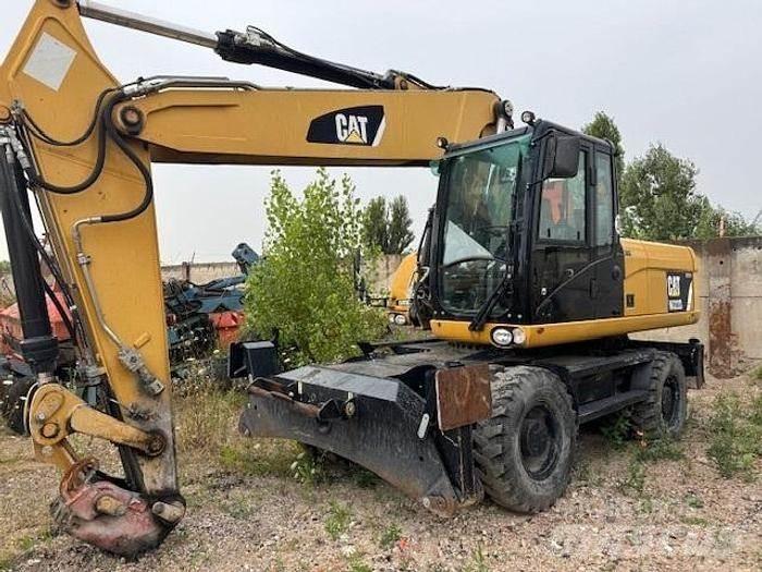 CAT M 322 D Ekskavatori uz riteņiem
