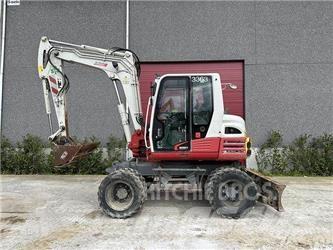 Takeuchi TB295W Ekskavatori uz riteņiem