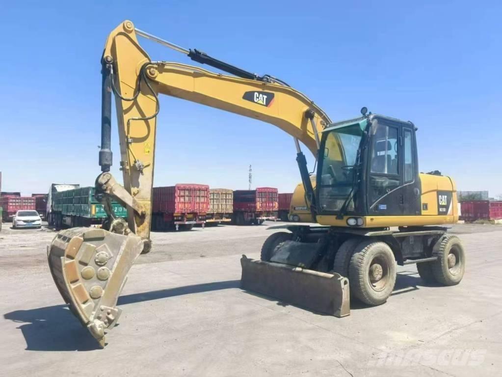 CAT M315D2 Ekskavatori uz riteņiem