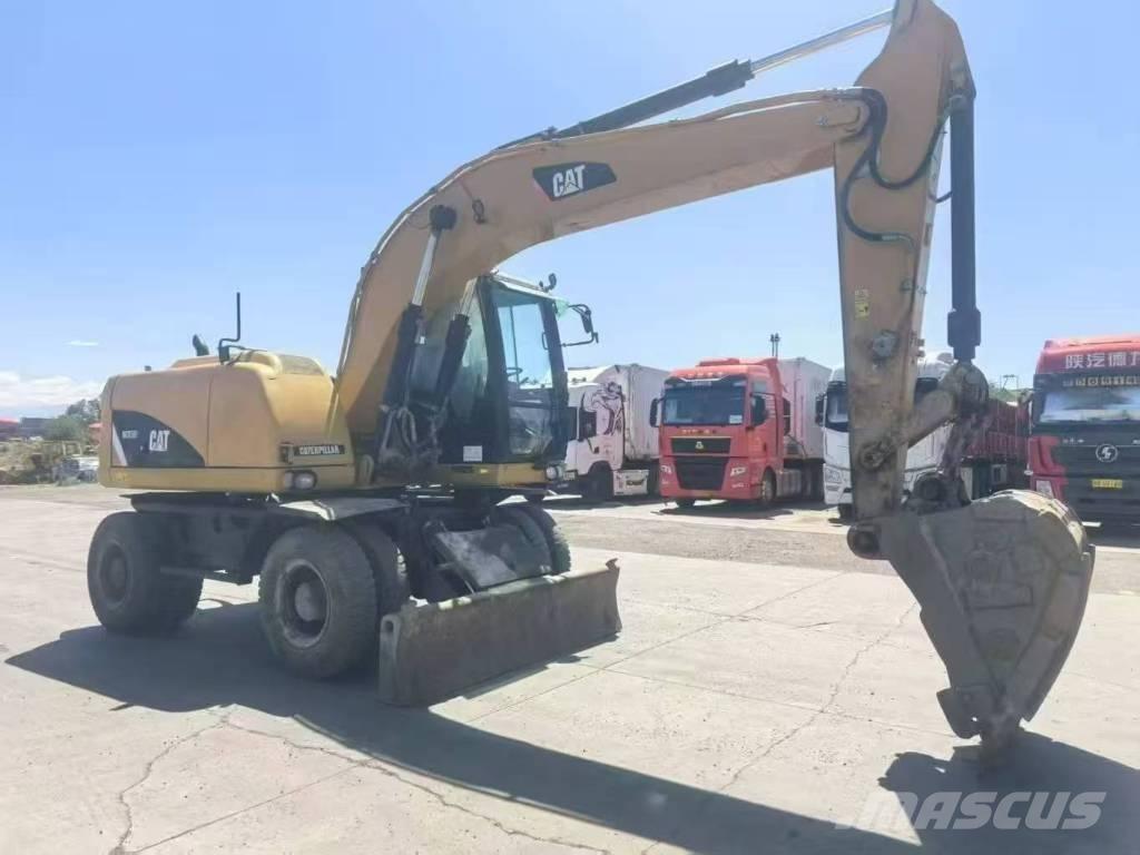 CAT M315D2 Ekskavatori uz riteņiem