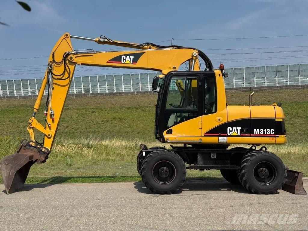 CAT M313C Ekskavatori uz riteņiem