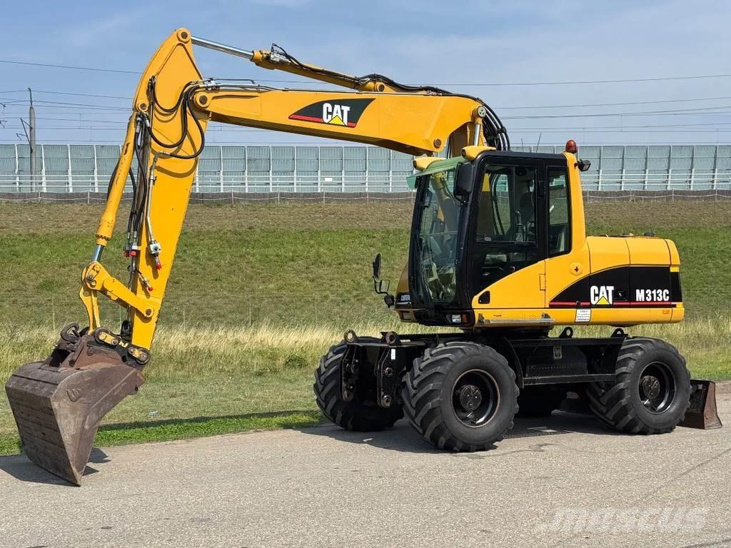 CAT M313C Ekskavatori uz riteņiem