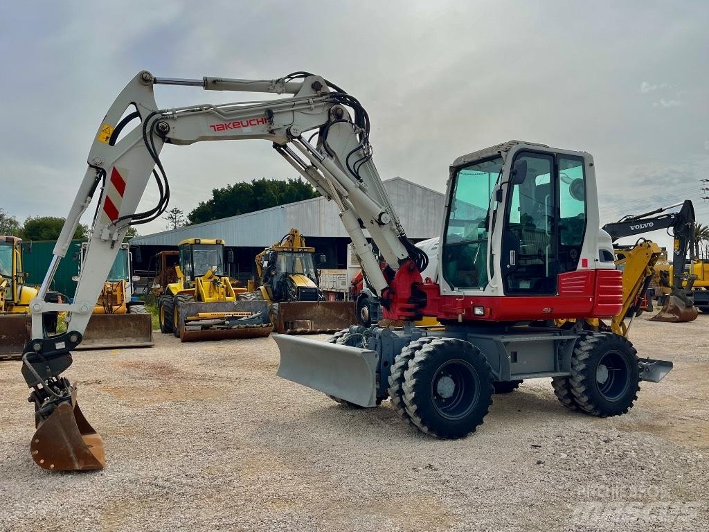 Takeuchi TB 295 Ekskavatori uz riteņiem