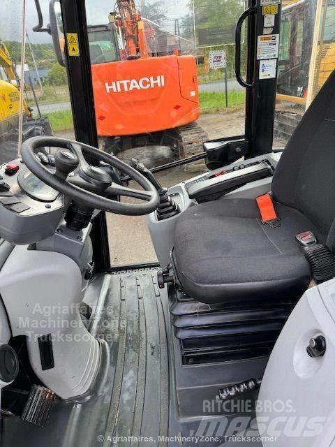 CAT 906 Iekrāvēji uz riteņiem