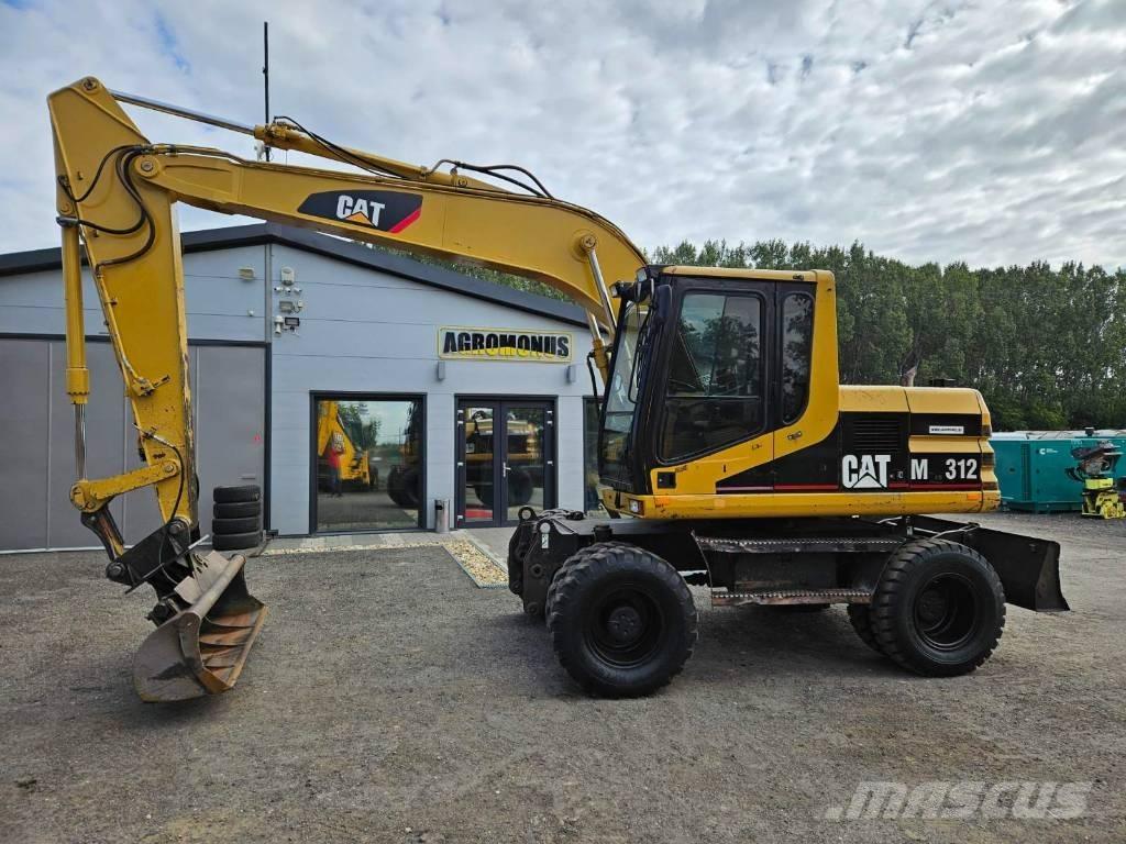 CAT M 312 Ekskavatori uz riteņiem