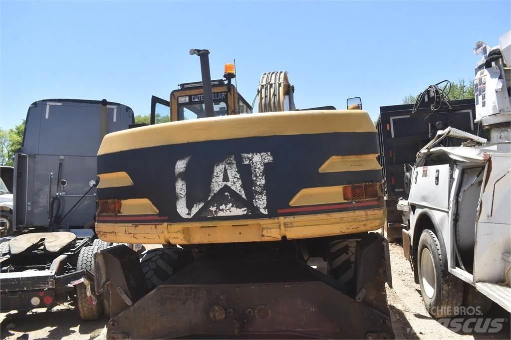 CAT M318 Ekskavatori uz riteņiem
