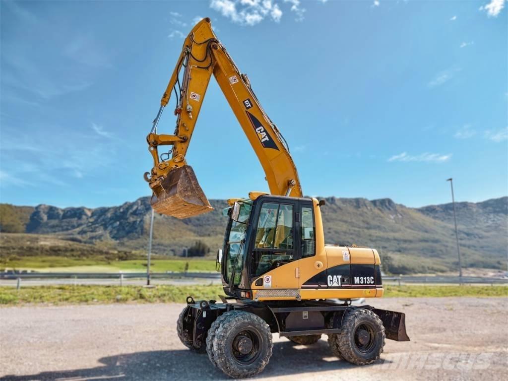 CAT M 313 C Ekskavatori uz riteņiem